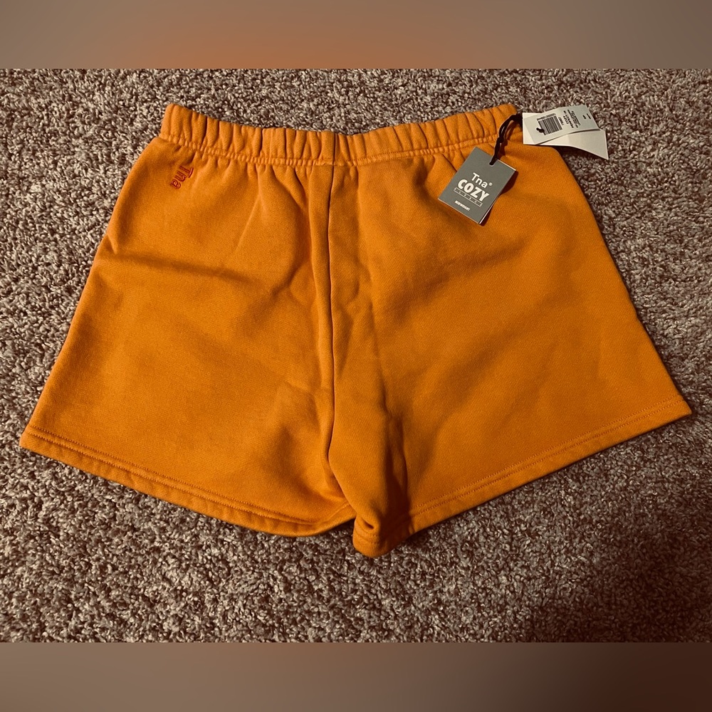 TNA cozy fleece perfect hi-rise 3" sweatshirt size S GD KOI ORANGE NWT Aritzia